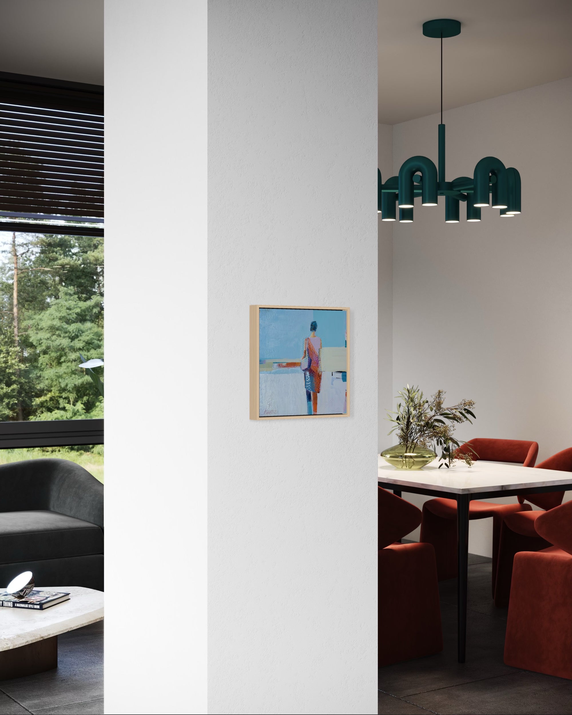 Modern interior with a chandelier, table, and sofa.
